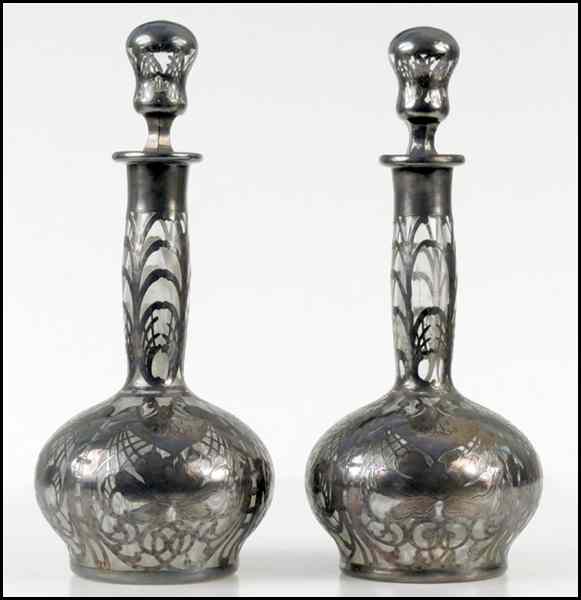 Appraisal: PAIR OF SILVER OVERLAY DECANTERS Height '' Condition No Specific