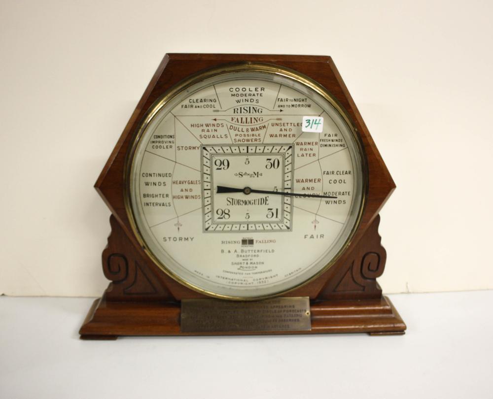 Appraisal: AN OAK 'STORMOGUIDE' DESK-TOP BAROMETER made by Short Mason Co