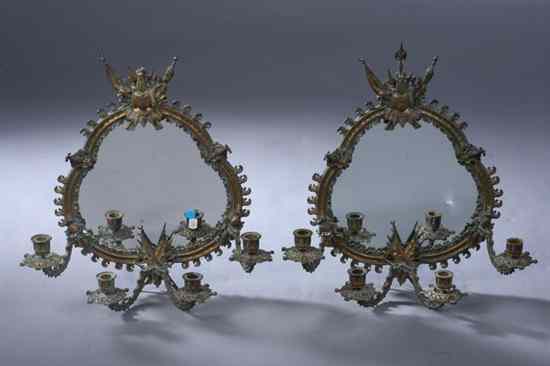 Appraisal: PAIR ITALIAN STYLE GILT-METAL FOUR-LIGHT GIRANDOLES with ''losses'' Serpentine-frame scrolling