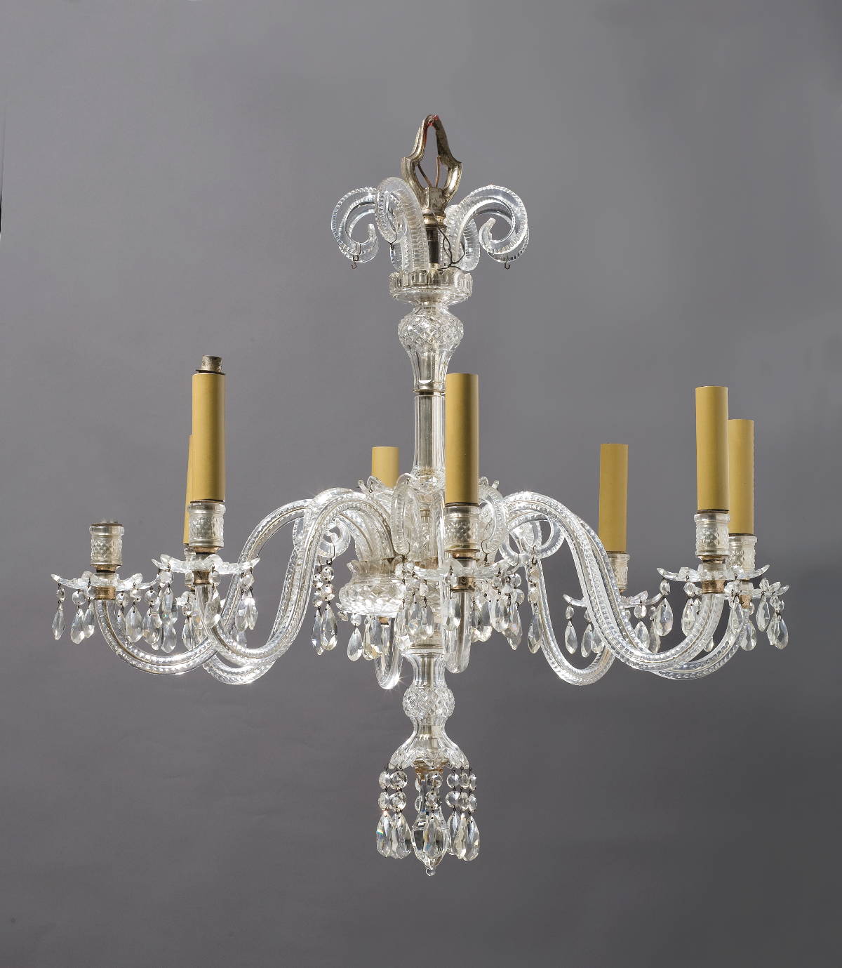 Appraisal: GEORGE III STYLE CUT-GLASS EIGHT-LIGHT CHANDELIER The cane corona above