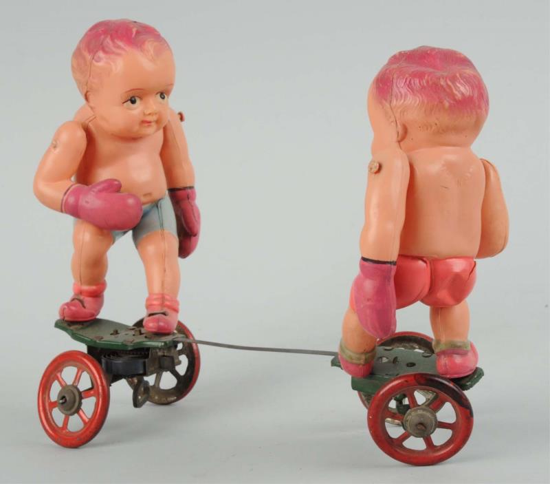 Appraisal: Celluloid Wind-Up Baby Boxer Toy Made in Japan with light