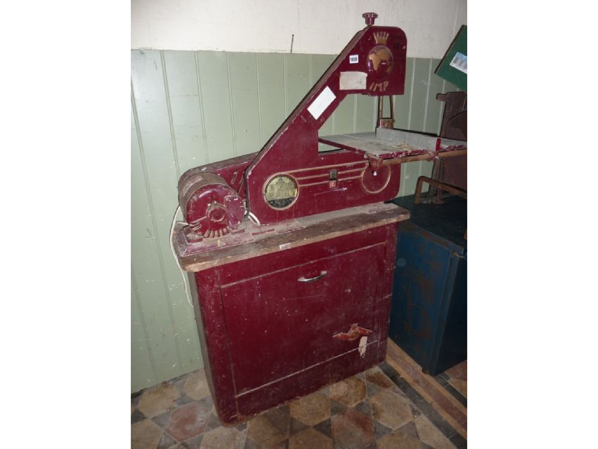 Appraisal: A Coronet tool band saw raised on cupboard base The