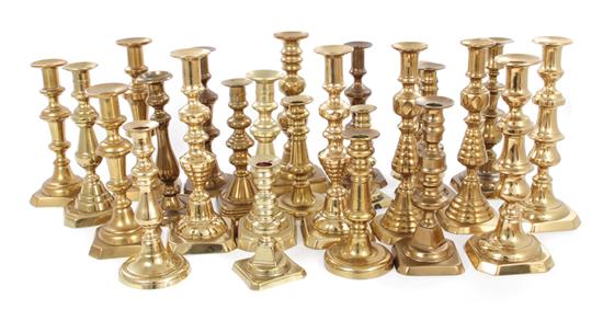 Appraisal: English brass candlesticks th th century nine pairs and seven