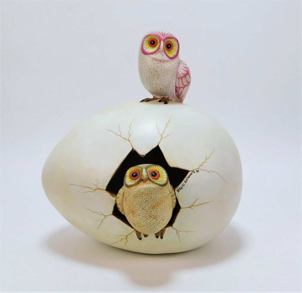 Appraisal: SERGIO BUSTAMANTE SURREALIST OWLS EGG SCULPTURE Mexico b Depicts a