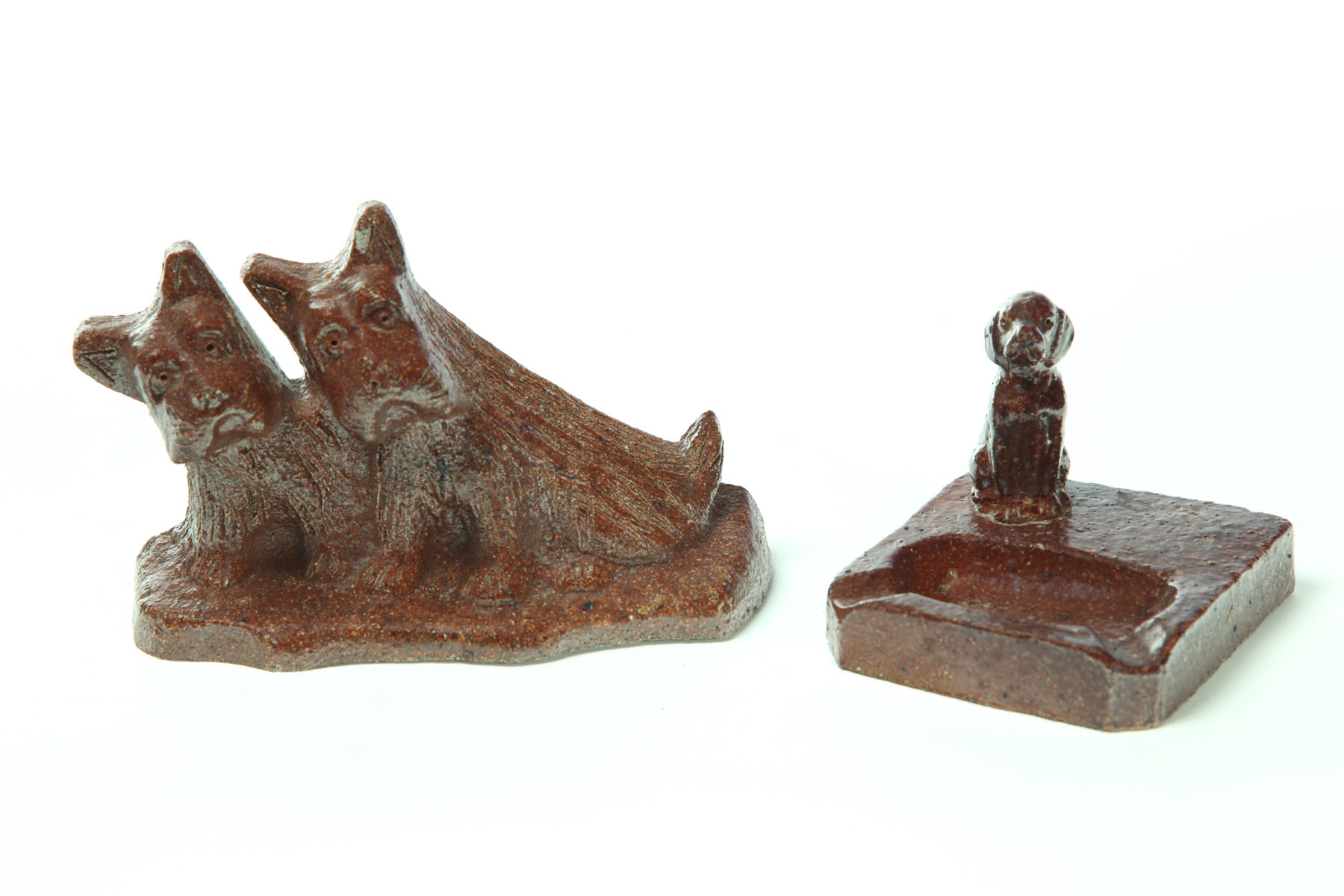 Appraisal: TWO SEWERTILE PIECES WITH DOGS Ohio early th century Both