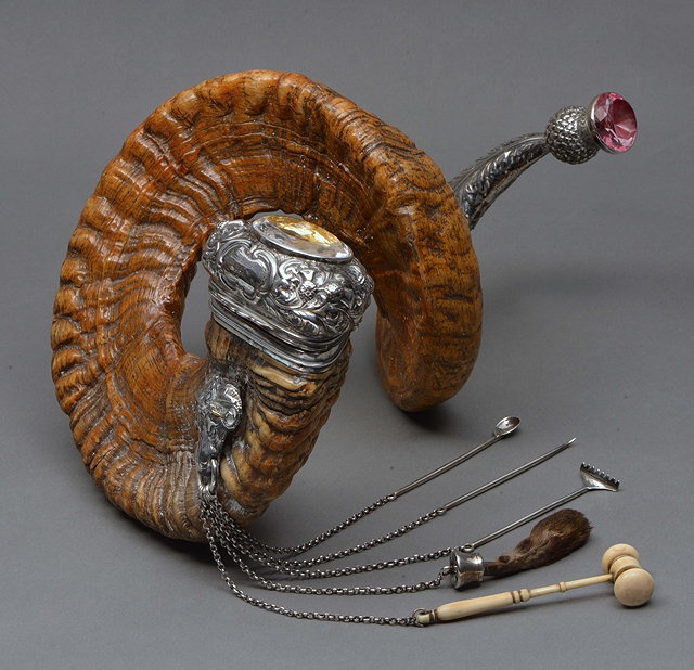 Appraisal: A VICTORIAN SCOTTISH SHEEPS HORN SNUFF MULL with embossed mounts