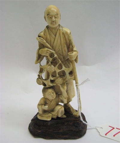 Appraisal: A JAPANESE IVORY CARVED FIGURE OF FATHER SON The father