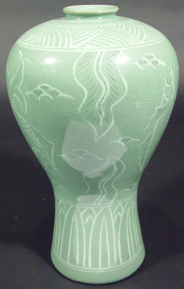 Appraisal: Oriental green celadon glazed vase painted with a continuous band