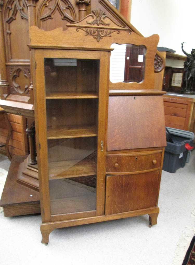 Appraisal: AN OAK SECRETARY BOOKCASE The Larkin Company Buffalo New York