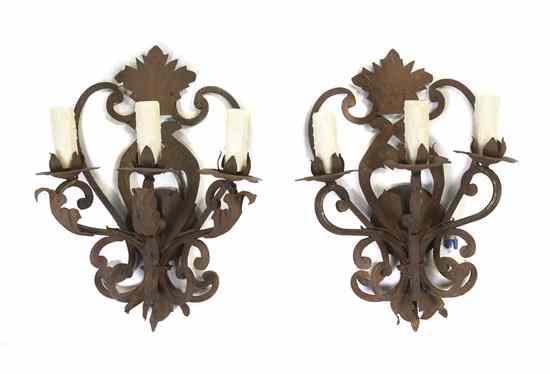 Appraisal: A Pair of Continental Wrought Iron Three-Light Sconces each having