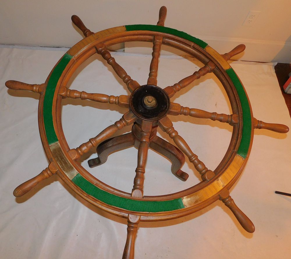 Appraisal: SHIP'S WHEEL COFFEE TABLE Old oak ship's wheel mounted as