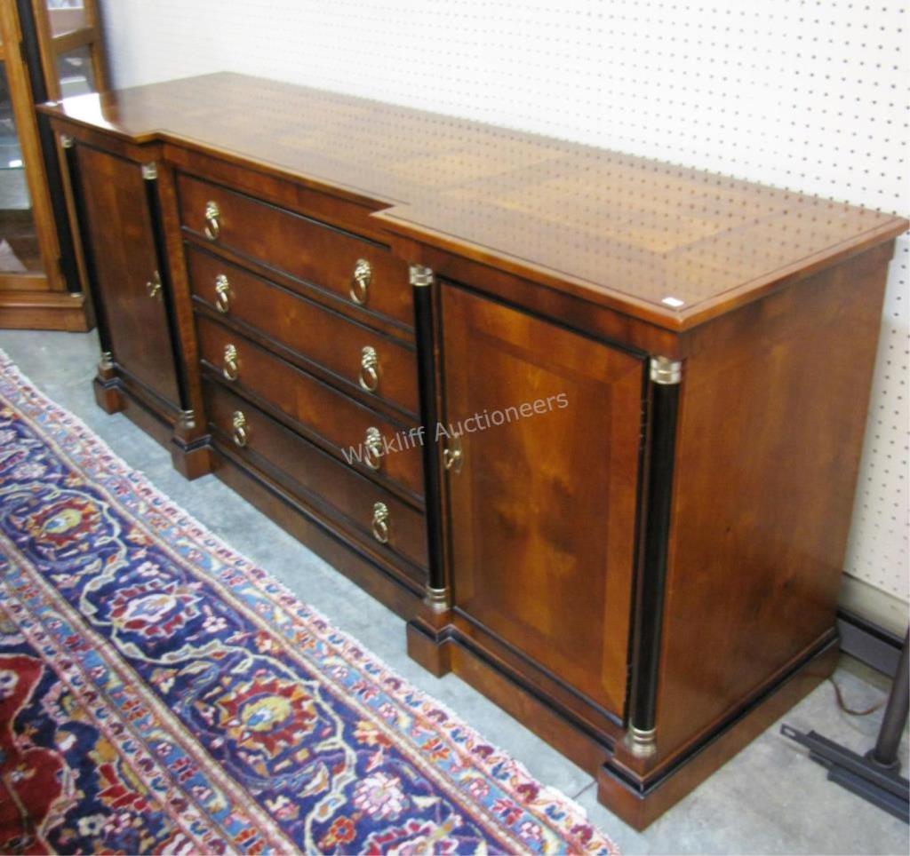 Appraisal: A transitional-styled sideboard by Century center section with four drawers