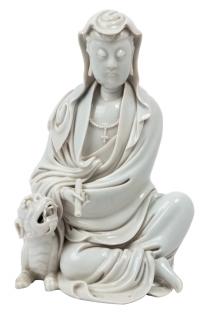 Appraisal: A BLANC-DE-CHINE GUANYIN AND LION GROUP QING DYNASTY LATE -EARLY