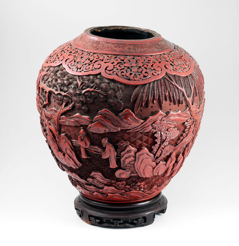 Appraisal: 'S CINNABAR VASE Carved with figures in mountainous landscape Missing