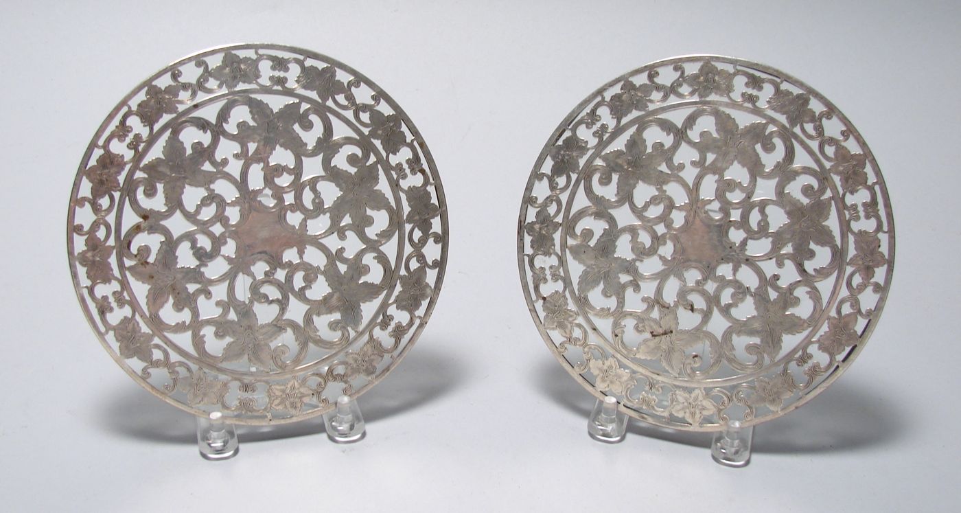 Appraisal: TWO STERLING SILVER AND GLASS HOT PLATES In circular form