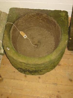 Appraisal: A YORKSHIRE STONE TROUGH of D form with dished circular