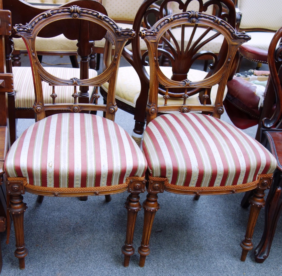 Appraisal: A pair of Victorian walnut framed side chairs with carved