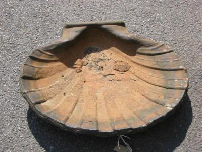 Appraisal: A VICTORIAN TERRACOTTA BIRD BATH modelled as a scallop shell