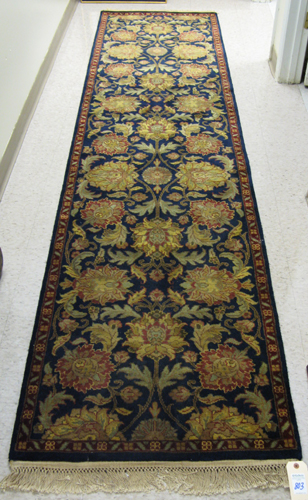 Appraisal: HAND KNOTTED ORIENTAL HALL RUG Indo-Persian colorful floral arabesque decoration