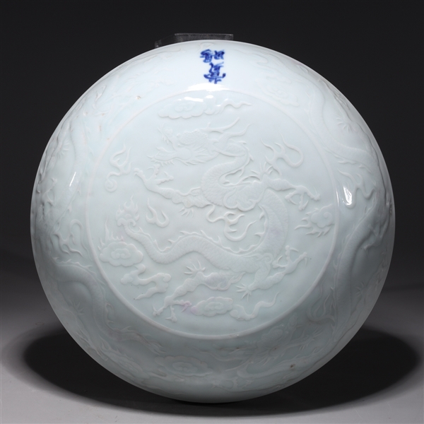 Appraisal: Chinese white glazed covered porcelain vessel with dragon designs and