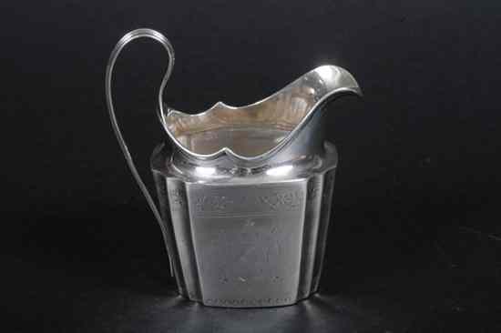 Appraisal: GEORGE III IRISH SILVER ARMORIAL CREAMER late th century rubbed