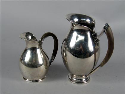 Appraisal: Two Continental silver cream jugs nsk sweden silver co denmark