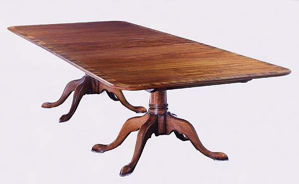 Appraisal: A George III style mahogany and rosewood crossbanded dining table