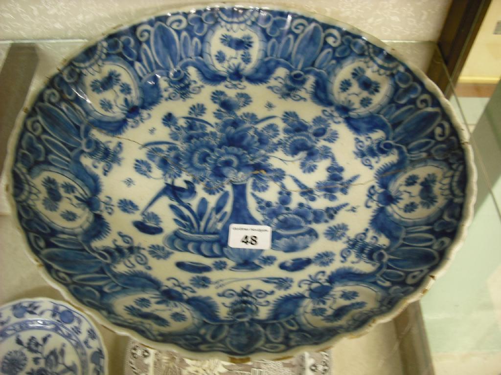 Appraisal: th century Delft chinoiserie blue and white painted lobed bowl