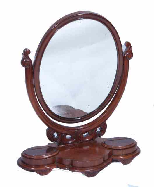 Appraisal: A VICTORIAN MAHOGANY DRESSING TABLE MIRROR the oval swing glass