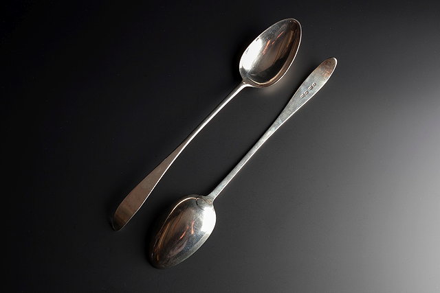 Appraisal: A PAIR OF POINTED END SILVER SERVING SPOONS c -