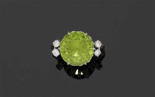 Appraisal: PERIDOT AND BRILLIANT-CUT DIAMOND RING ca White gold Classic ring