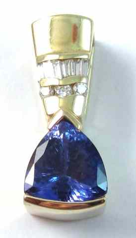 Appraisal: DIAMOND AND TANZANITE PENDANT k yellow gold set with three