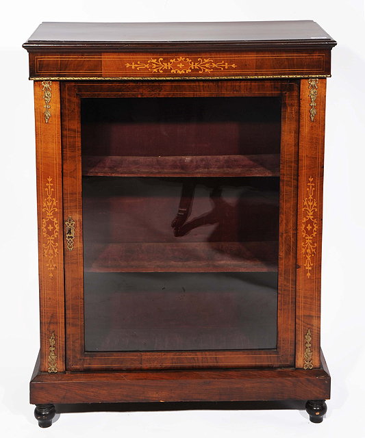 Appraisal: A VICTORIAN WALNUT PIER CABINET with single glazed door enclosing