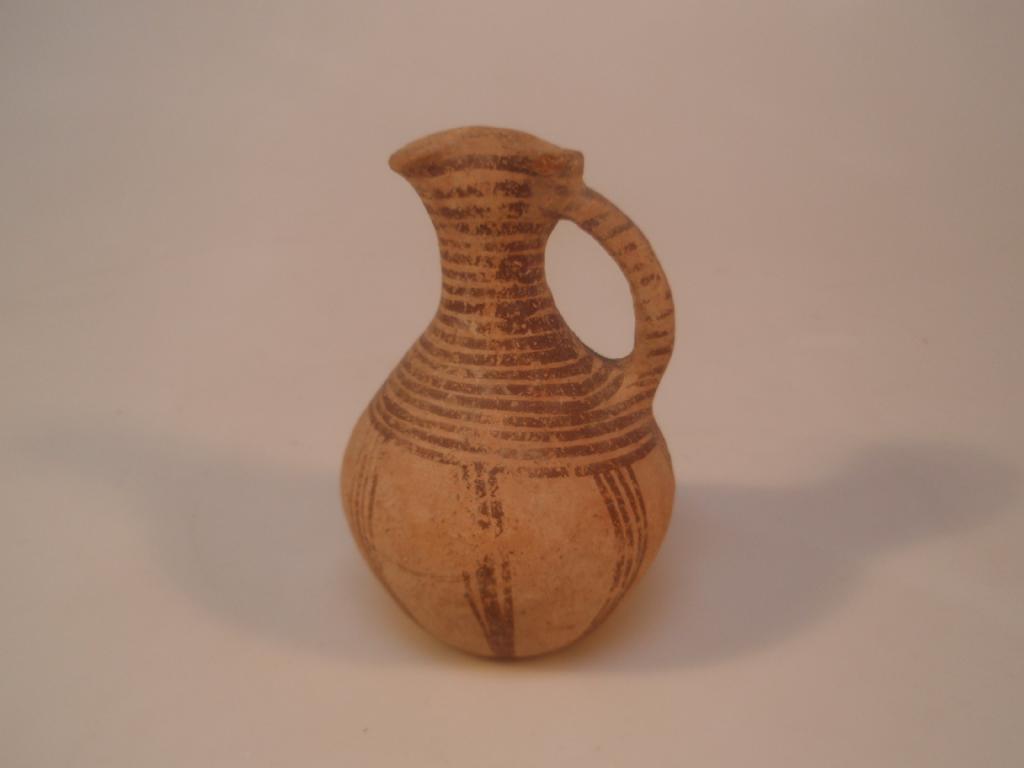 Appraisal: A Bronze Age Cypriote pottery oenochoe the funnel mouth flattened