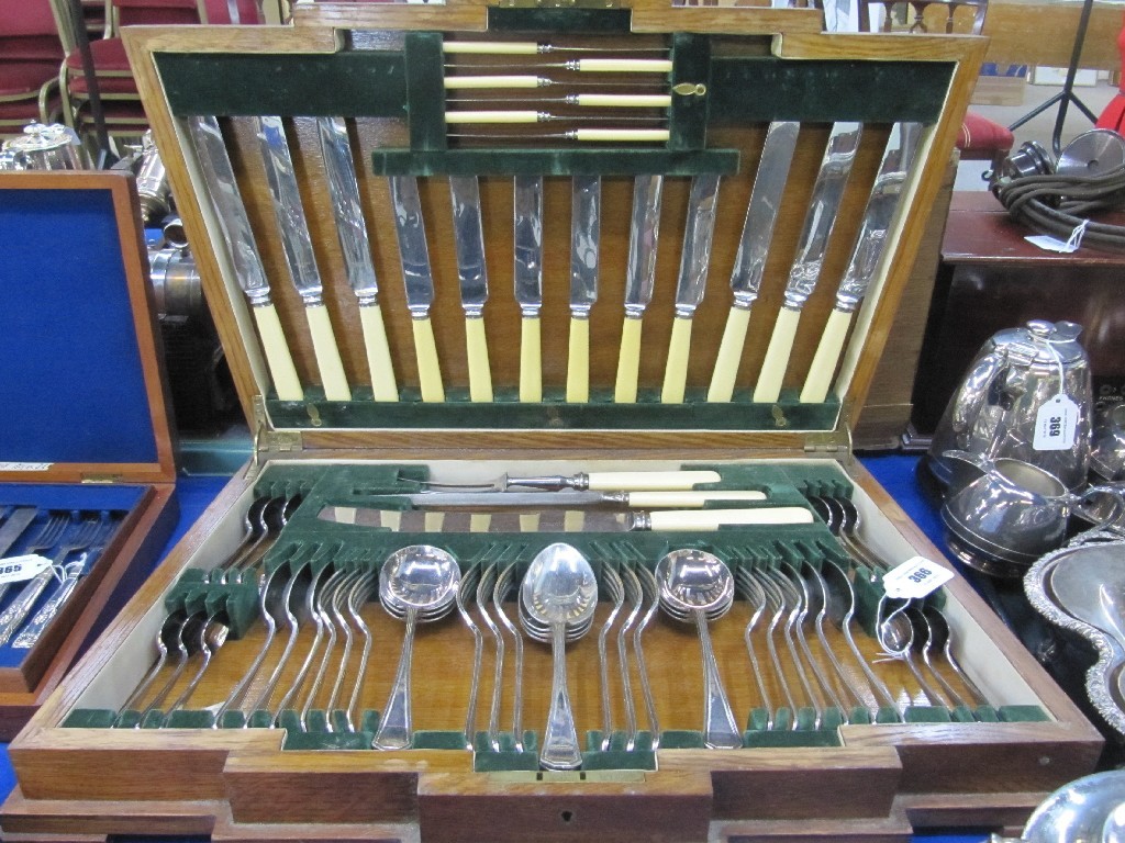 Appraisal: An Art Deco oak canteen of cutlery pieces