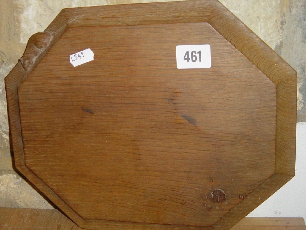 Appraisal: A small carved Mouseman breadboard octagaonal tray with mouse decoration