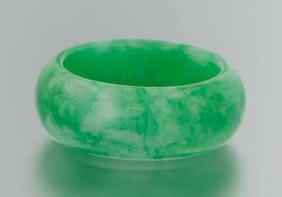 Appraisal: A Carved Jadeite Ring Well carved and smoothly polished approx