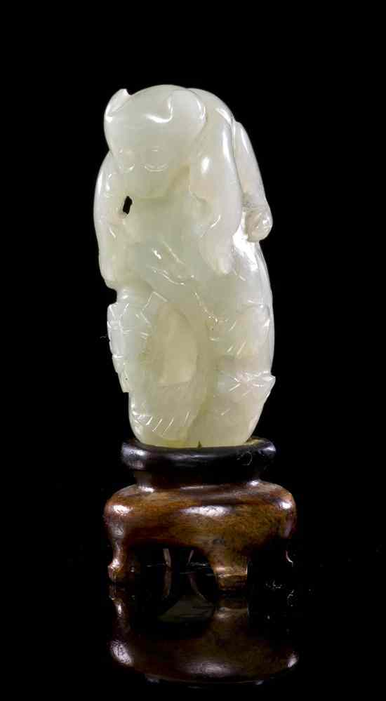 Appraisal: A Chinese White Jade Toggle of a Monkey the animal