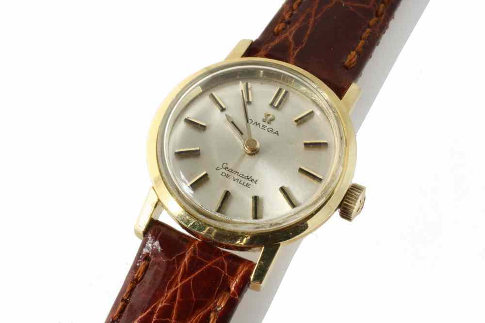 Appraisal: LADY'S WATCH - One K yellow gold Omega Seamaster DeVille