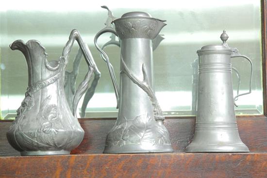 Appraisal: THREE PIECES OF PEWTER A pitcher with embossed floral and