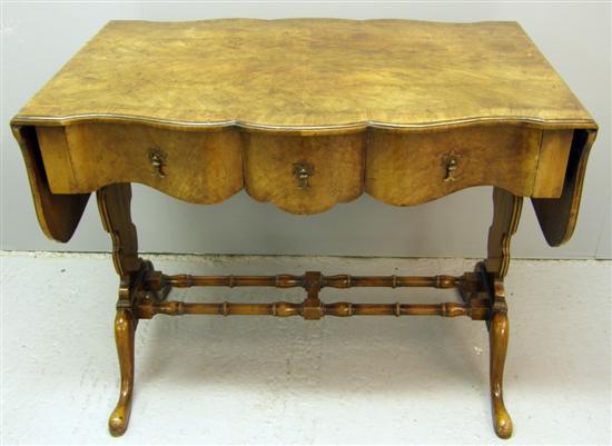 Appraisal: th century serpentine walnut sofa table with three drawers raised