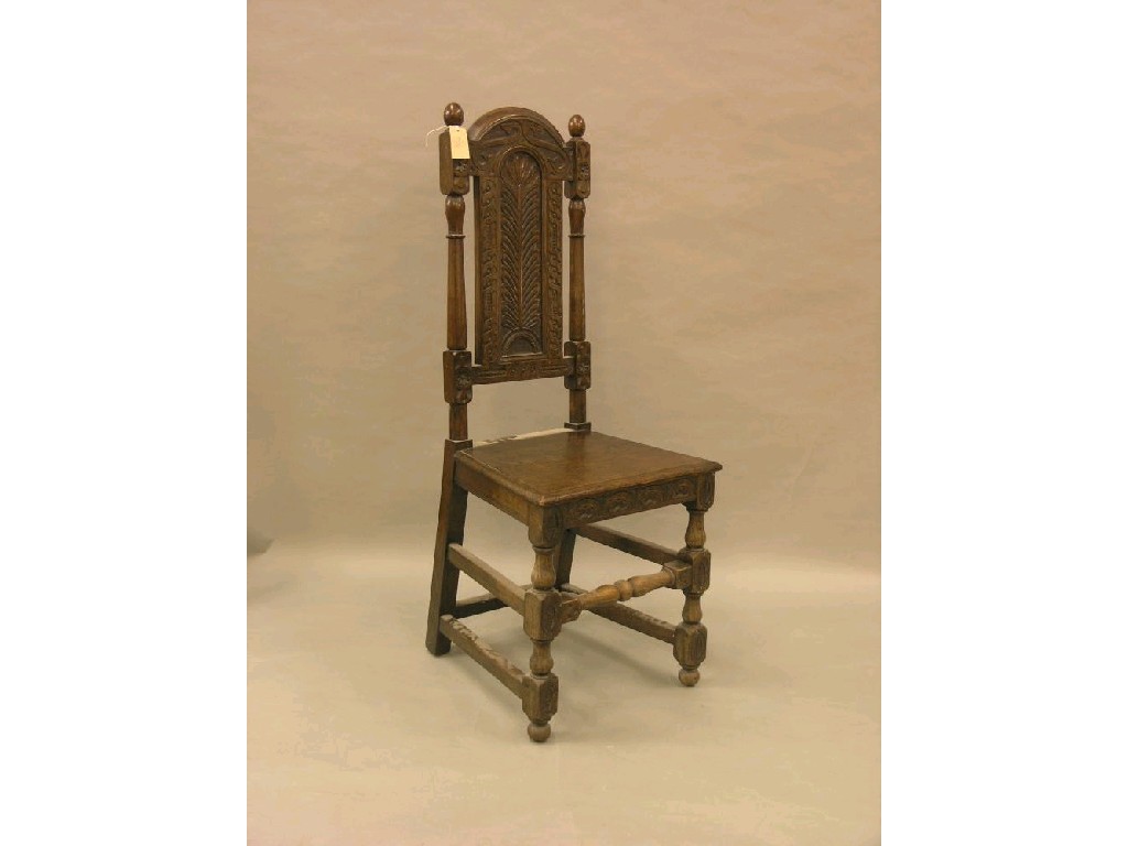 Appraisal: A late Victorian carved oak hall chair with solid seat