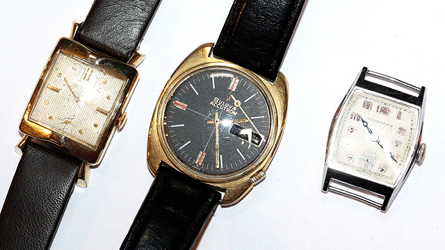 Appraisal: A GENTLEMAN'S GILT METAL BLACK FACE BULOVA WRIST WATCH a