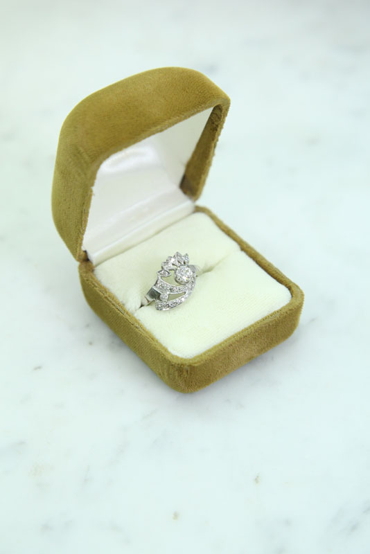 Appraisal: DIAMOND RING mm full cut diamond surrounded by pave set