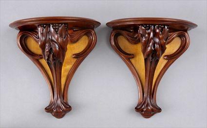 Appraisal: PAIR OF FRENCH ART NOUVEAU CARVED WALNUT WALL BRACKETS Each