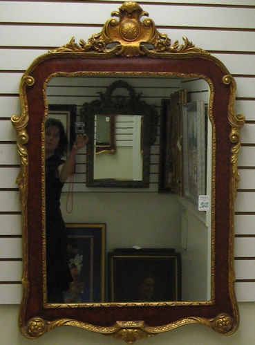 Appraisal: A DECORATIVE FRENCH STYLE WALL MIRROR the gilt accented faux