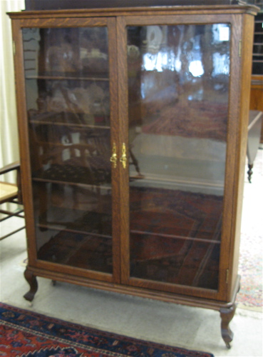 Appraisal: LATE VICTORIAN OAK CABINET BOOKCASE American c the interior divided