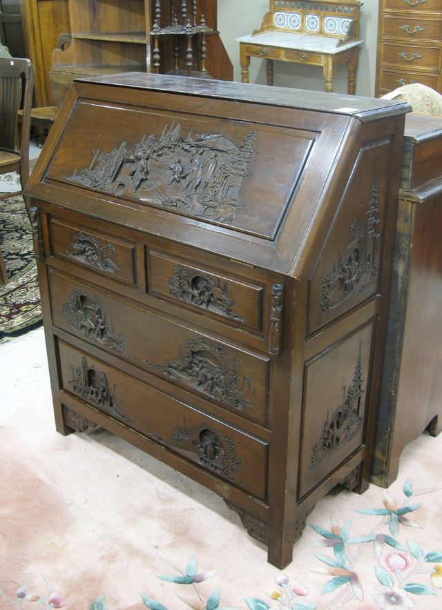 Appraisal: CARVED TEAK SLANT-TOP DESK Chinese th century the slant top