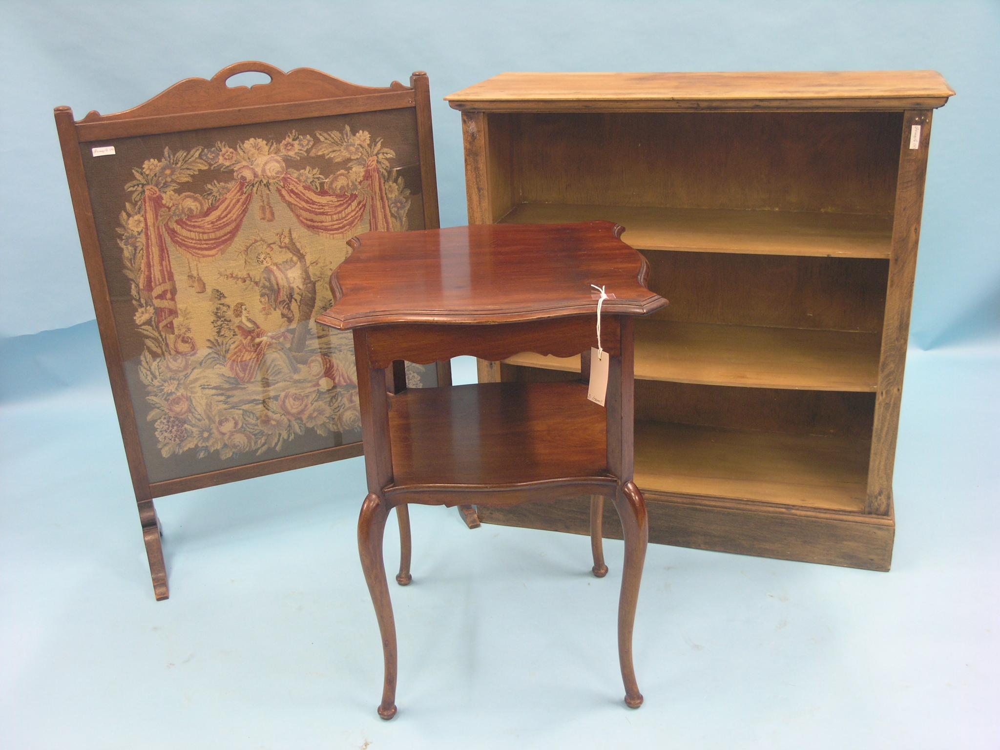 Appraisal: A Victorian walnut two-tiered occasional table serpentine shape ft in