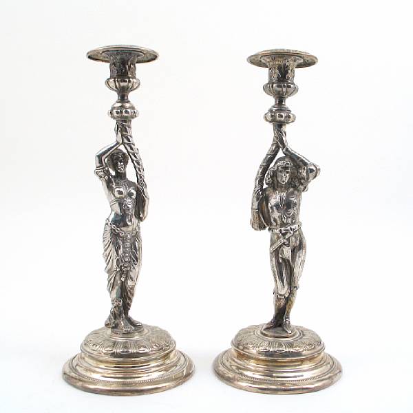 Appraisal: A pair of silverplate figural candlesticks after the antique Male